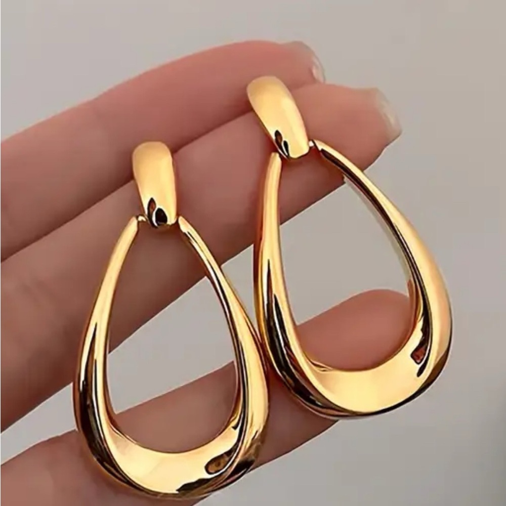 Gold tone dangle earrings, perfect for everyday use